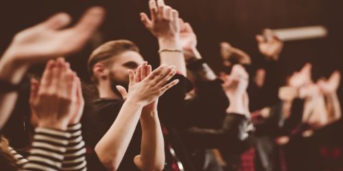 Audience applauding in the theater